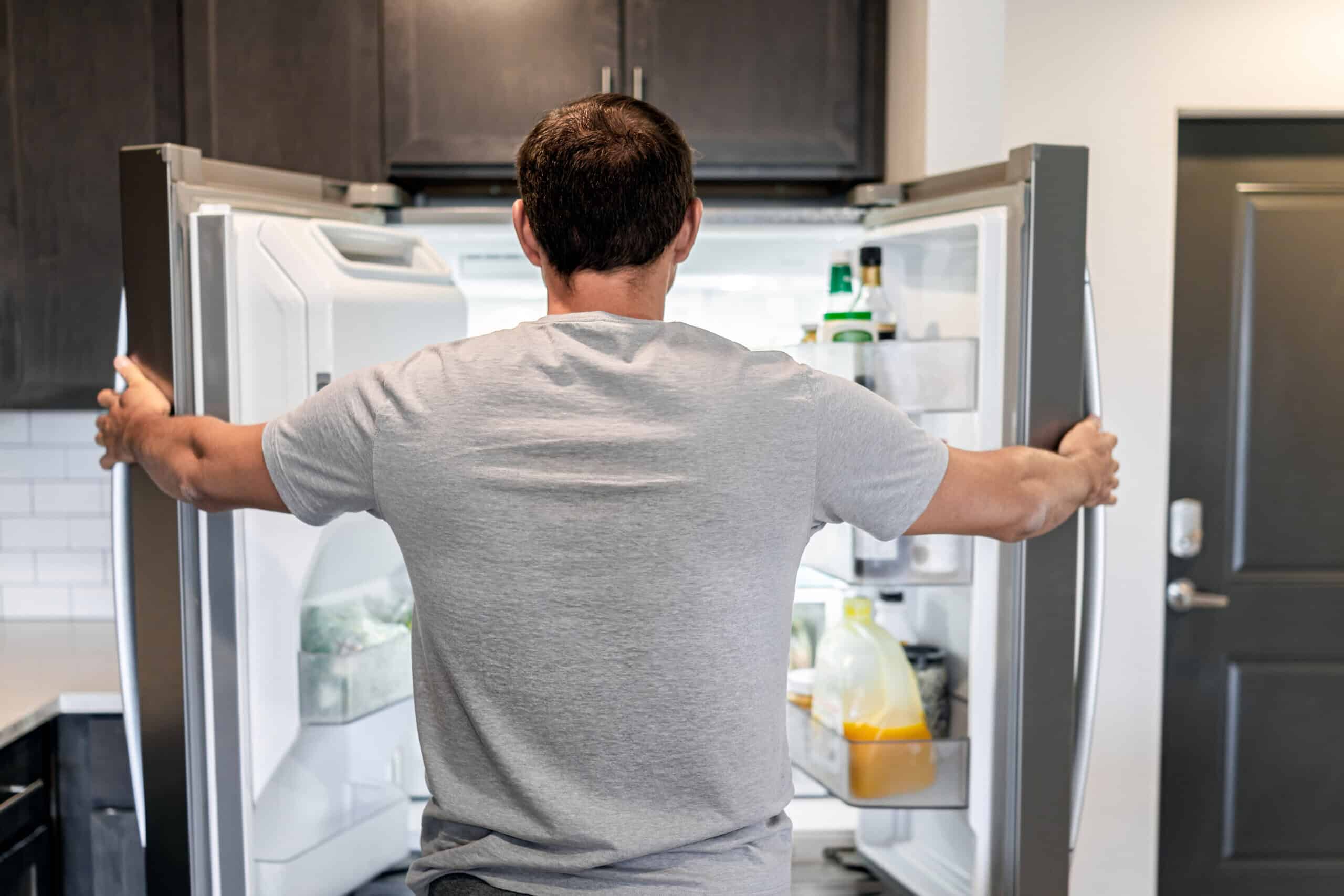What is food noise? Man searching for food in fridge