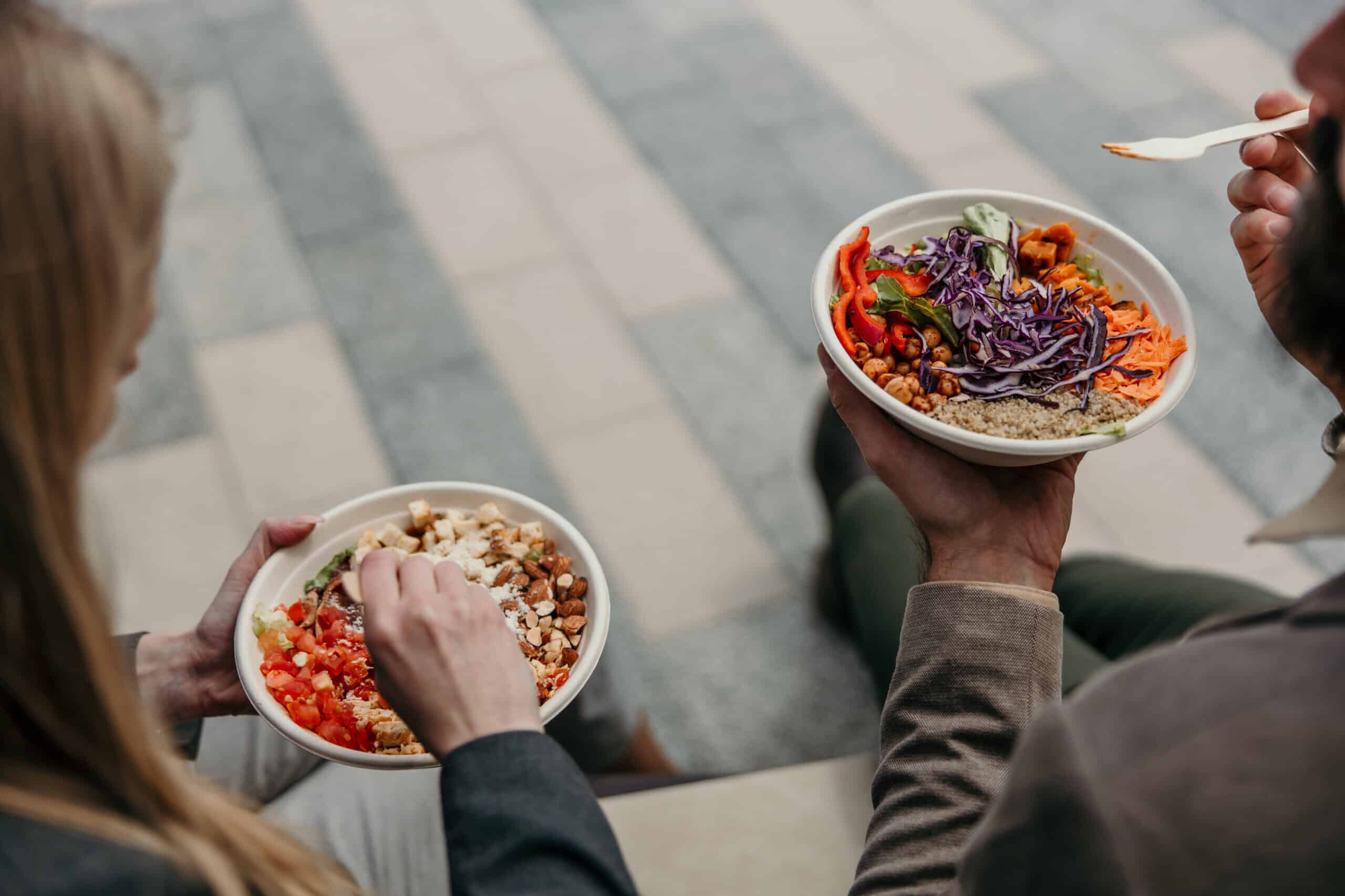 Couple eating healthy takeaway options